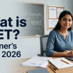 An Indian teaching aspirant smiling at her desk with a laptop and CTET exam papers in a clean classroom, text overlay reads What is CTET Beginner Guide 2026.