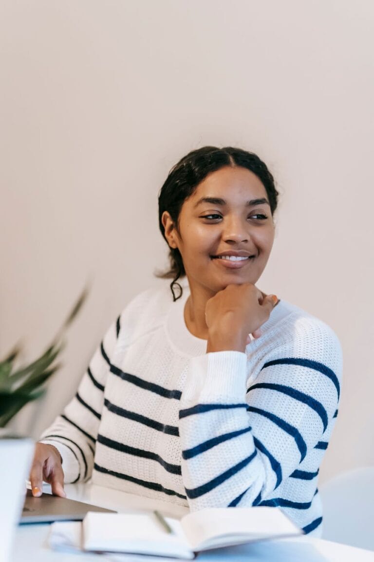 Indian student smiling while studying at home